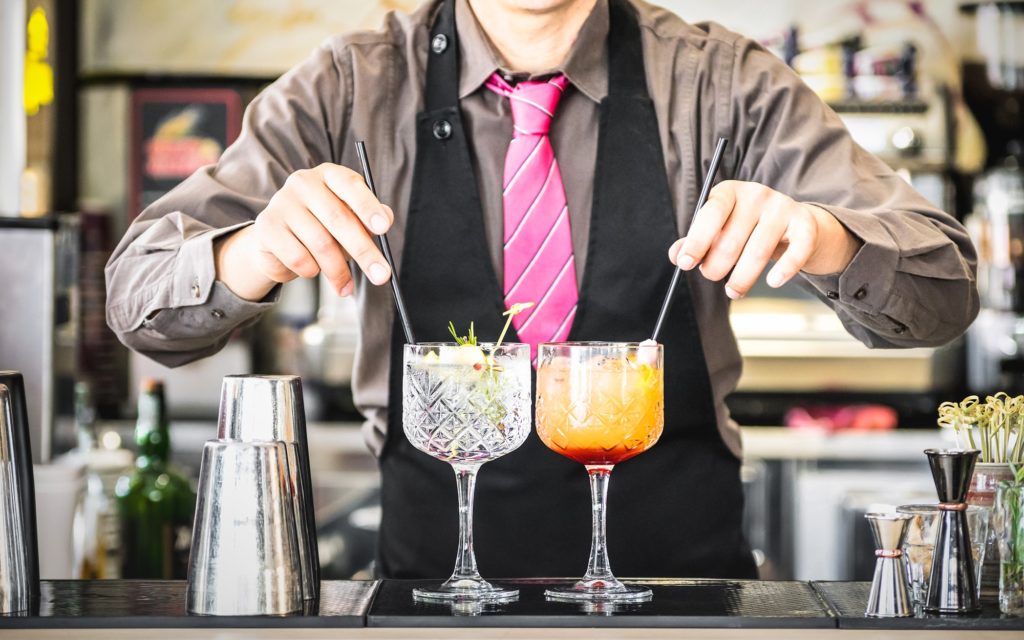 Bartender serving mixed drinks